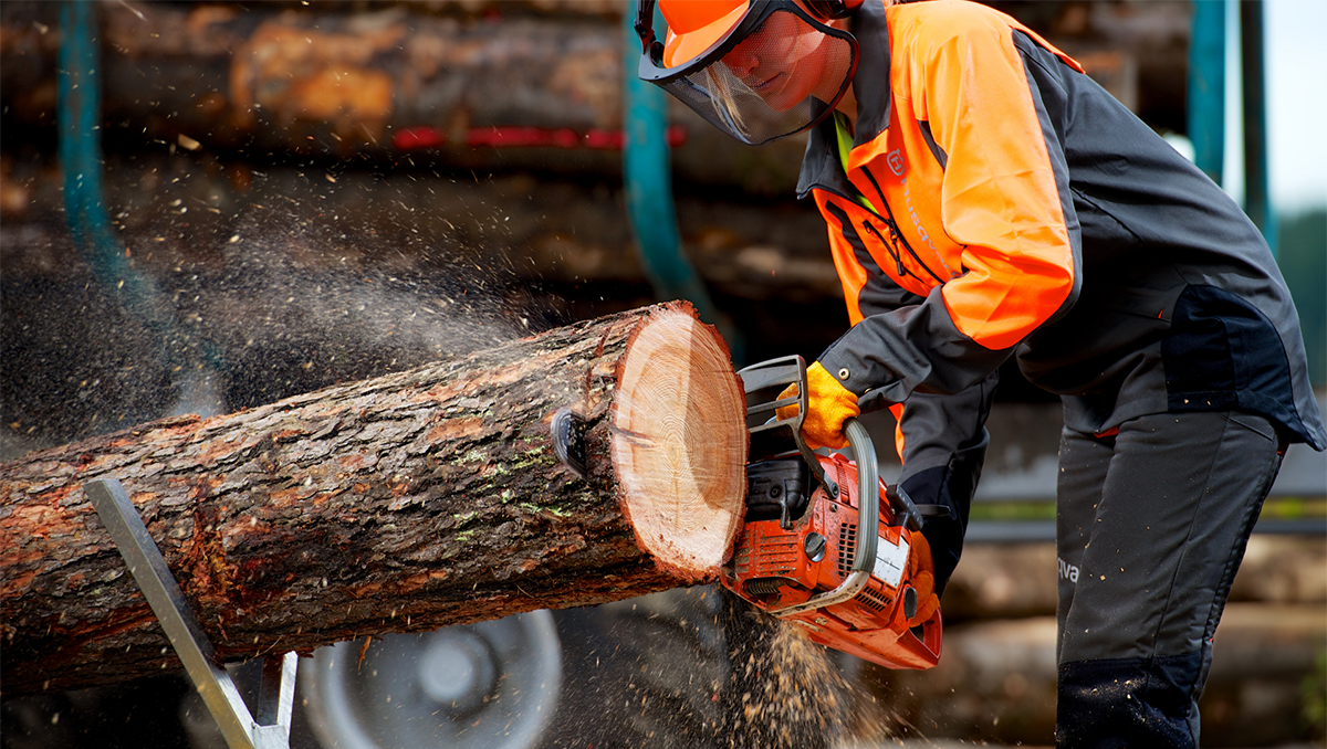 a man is using a chainsaw